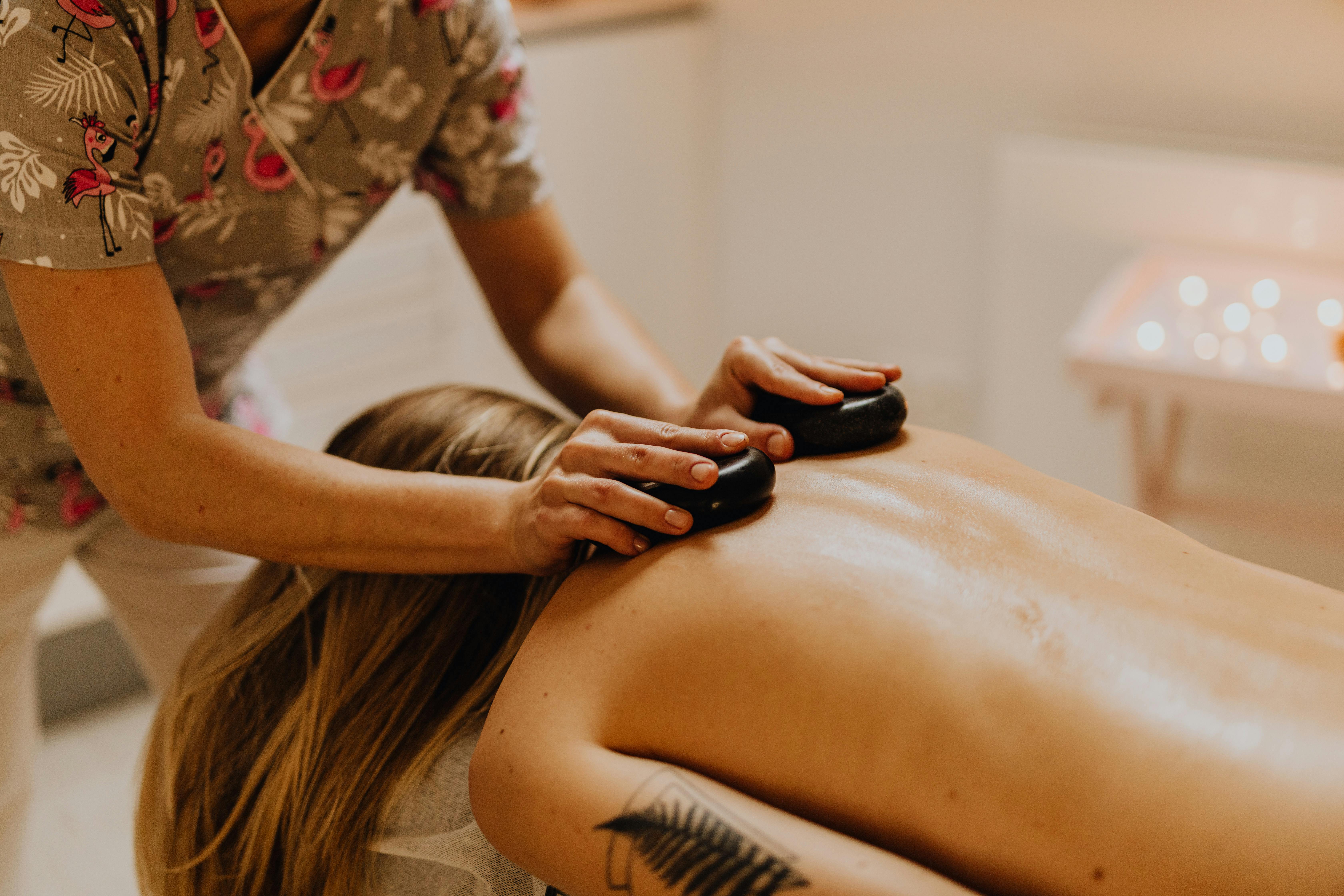 Massage therapy with hot stones.